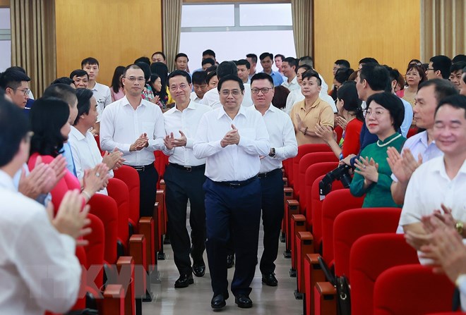 Thủ tướng Phạm Minh Chính đến thăm và làm việc với Hội Nhà báo Việt Nam. (Ảnh: Dương Giang/TTXVN)