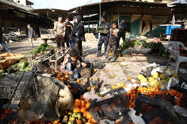 Hiện trường vụ đánh bom xe nhằm vào một khu chợ ở Syria