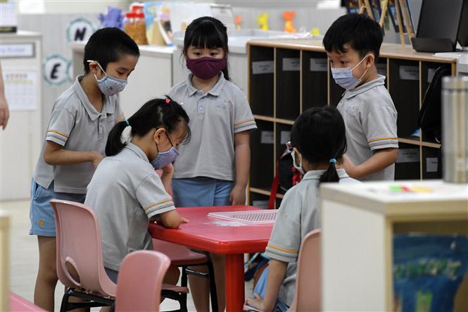 Trẻ em đeo khẩu trang phòng lây nhiễm COVID-19 tại một lớp học ở Singapore, ngày 2/6/2020