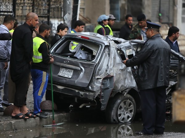 Hiện trường một vụ nổ bom ở trung tâm thủ đô Baghdad. (Nguồn: AFP/TTXVN)