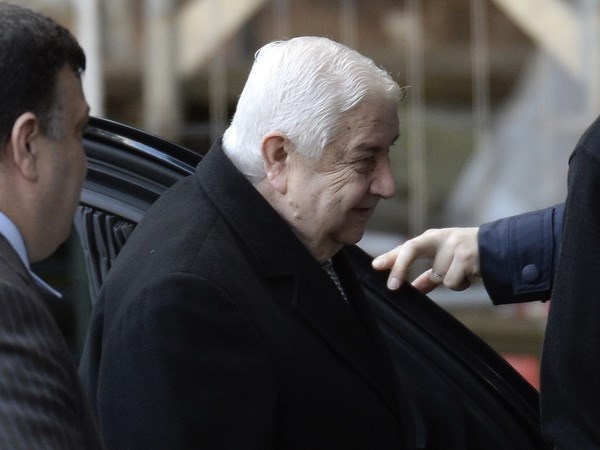 Ngoại trưởng chính phủ Syria Walid al-Moualem tới trụ sở Liên hơp quốc ở Geneva. (Nguồn: AFP/TTXVN)