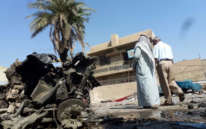 Hiện trường một vụ đánh bom ở Baghdad, Iraq. (Nguồn: AFP)