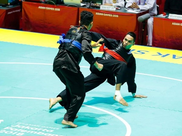 Võ sỹ Trần Đình Nam đeo đai đỏ trong trận chung kết hạng cân từ 70-75kg nam môn Pencak Silat. (Ảnh: Trọng Tuệ-Phúc Hưng/TTXVN)